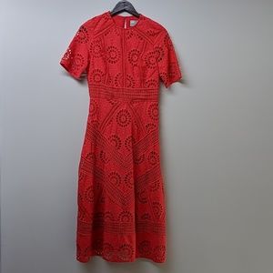 Red knee-length cutout dress